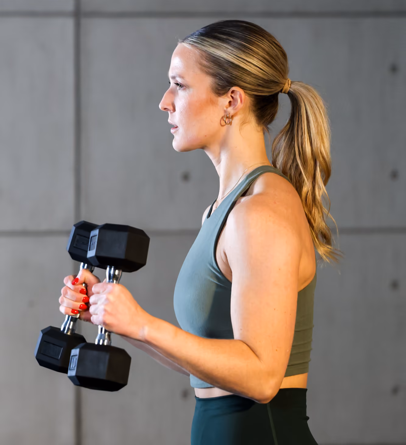 Woman curling dumbbells
